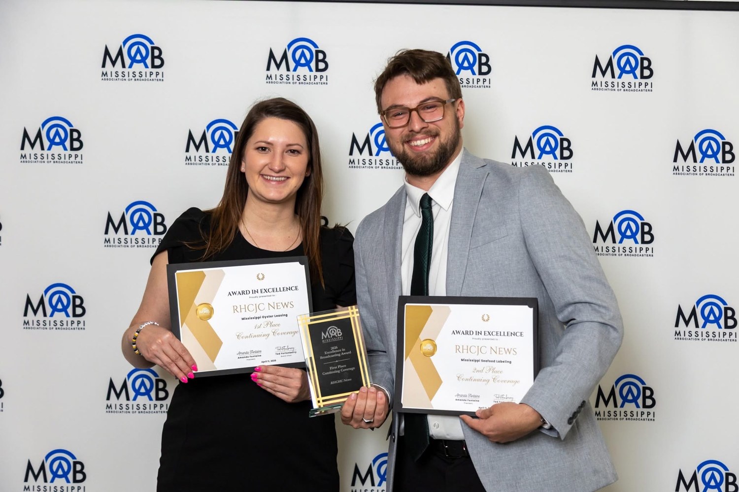 Justin and a colleague holding awards at a Mississippi Association of Broadcasters event.