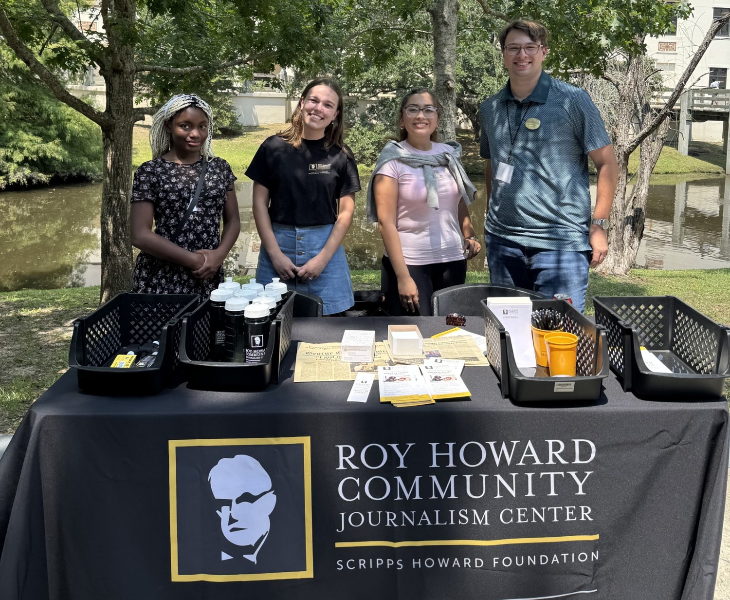 Justin and colleagues at an RHCJC community outreach table.
